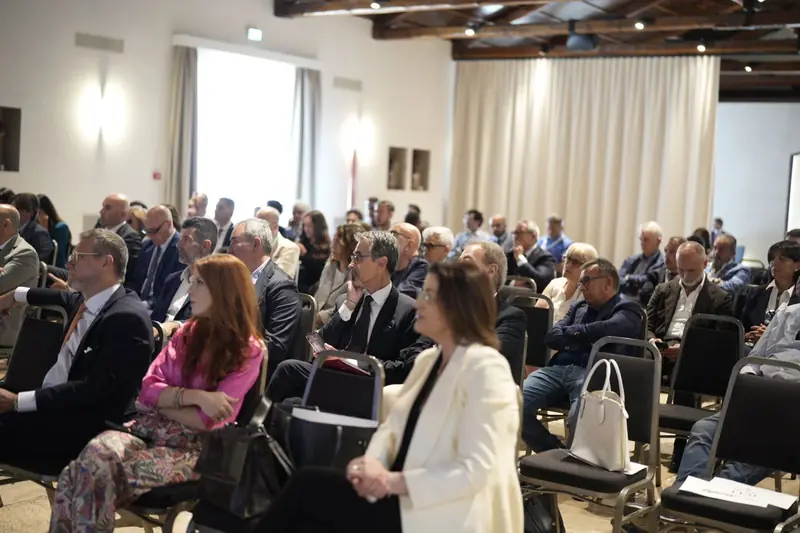 Participants listening to a plenary session at the first edition of the conference in 2025.