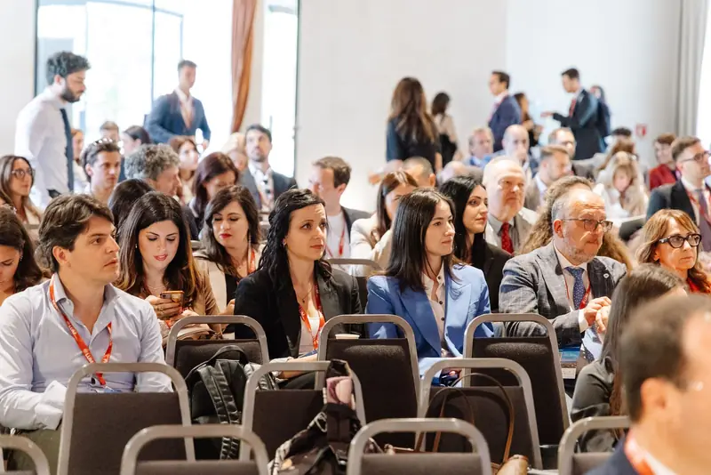 Participants following a plenary session at the 2026 edition of the conference.